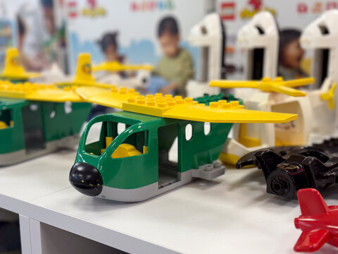 Colorful plastic building-block toy airplane close-up