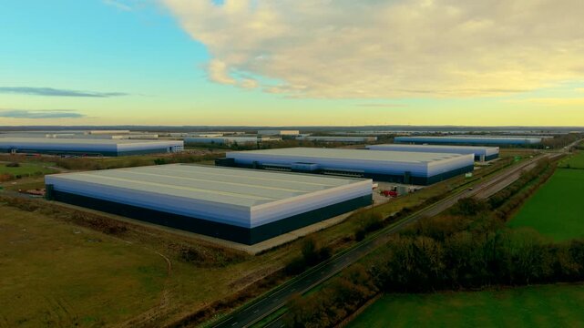 Expansive warehouse parks operating logistics infrastructure within regional industry. Broad distribution compounds managing cargo flow inventory routing transport coordination. Modern industrial