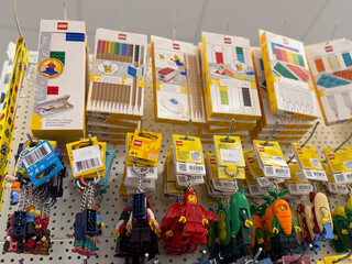 Naklejka premium Lego stationery and keychains on retail pegboard display