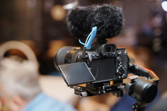 Camera on a stabilizer setup for recording in a busy indoor space