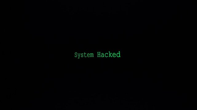 Zoom System Hacked Screen, displaying green text on a black background, resembling a classic hacking alert with a digital font, conveying a sense of intrusion.