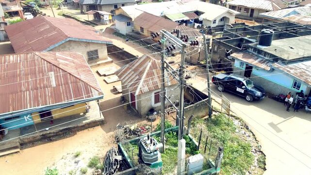 Drone shot of traditional village settlement surrounded by nature