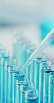 Science, pipette and liquid in test tubes in lab for enzyme analysis, biological staining or innovation. Biology, chemical and vial samples in containers for cell culture, medical research or closeup