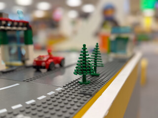 Obraz premium Miniature lego road with pine trees