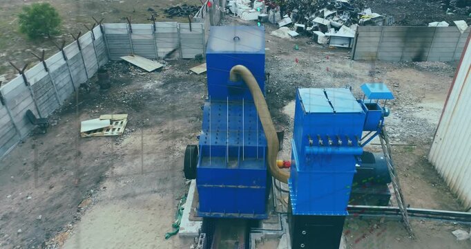 Animation of trading board and grid pattern over aerial view of recycling machine