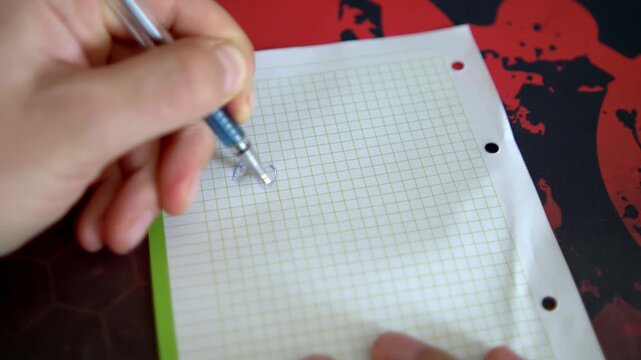 A pen creates letters on grid paper. The writing process is showcased against a vibrant, patterned backdrop.