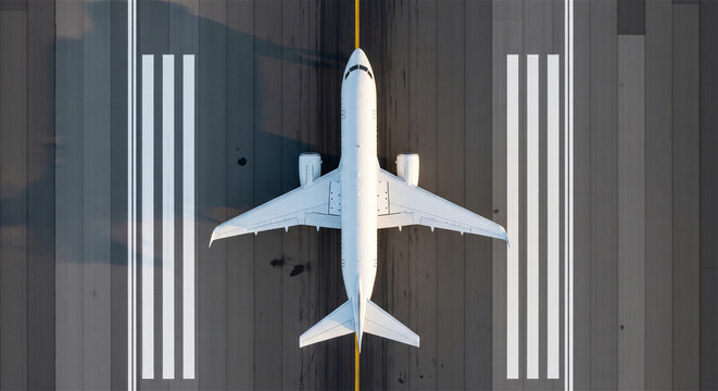 Aerial top view of white commercial airplane on airport runway, passenger jet aircraft taking off or landing, aviation transport and travel concept