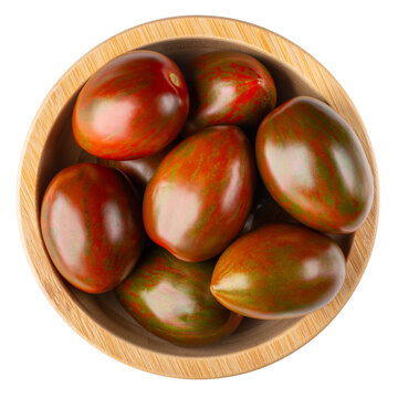 Black cherry tomatoes in wooden bowl isolated on white. Kumato plum tomato. Top view.