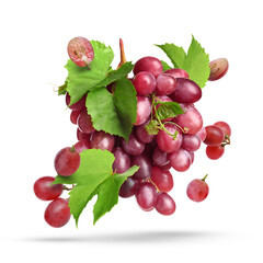 Obraz premium Fresh juicy grapes and green leaves falling against white background