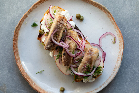 Sardines and apple salad on toast