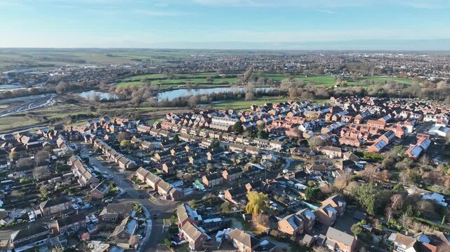 Aerial drone panorama of Barton Seagrave village and river valley on sunny winter day Northamptonshire