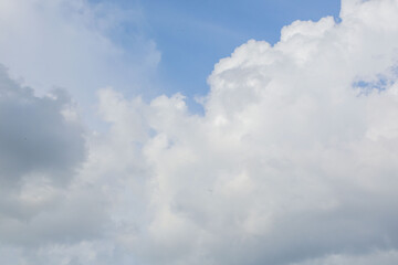 Obraz premium Blue sky with white clouds background, clear weather and natural sky texture, minimal abstract nature backdrop with copy space.