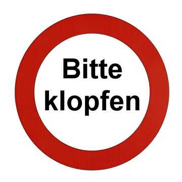 Rundes Schild mit rotem Rand und der Aufschrift "Bitte klopfen"	