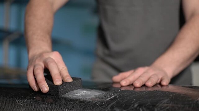 Sandpaper. Carbon fiber part. Carbon fiber. High quality 4k footage