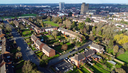 Fototapeta premium Aerial View of Suburban Neighborhoods with Red Brick Houses and Green Trees