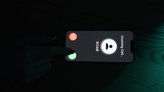 The user taps the red button to decline the "SCAM" call, preventing potential interaction with fraudsters.