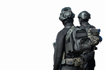 Fototapeta premium Special forces personnel in full tactical gear against a white background. The personnel are seen wearing ballistic helmets, balaclavas, tactical vests with backpacks, and dark tactical fatigues.