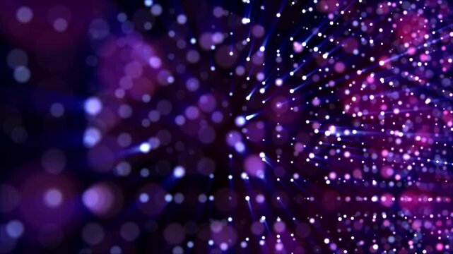 Purple and blue glowing particles radiating outward with depth and motion, forming a dynamic abstract light burst with bokeh and futuristic energy.