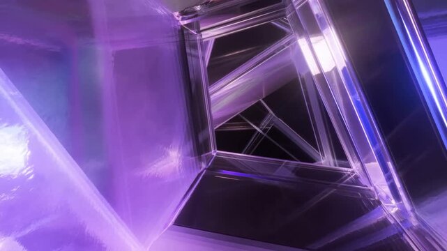 Tracking shot of reflective glass prism tunnel rotating forward through abstract neon interior installation with glossy purple and blue lighting passing geometric panels