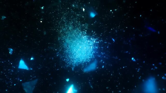Slow motion tracking shot of blue glowing particles and glass shards exploding and dispersing against black background in abstract void