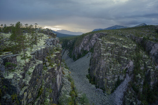 Drone point of view of Jutulhogget canyon under cloudy sky