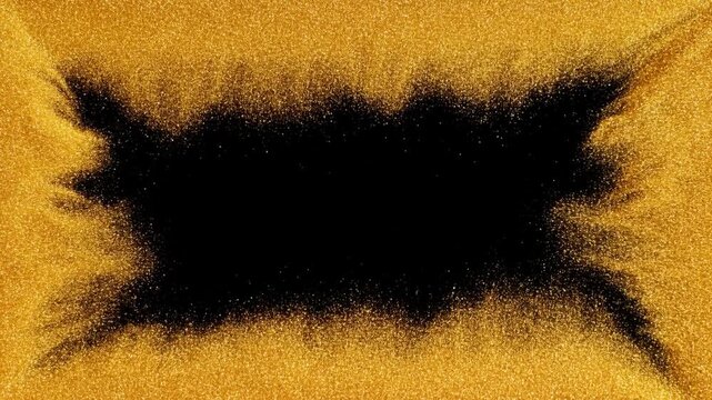 Static overhead slow motion of gold glitter particles sweeping inward to reveal black center void on flat studio surface closeup