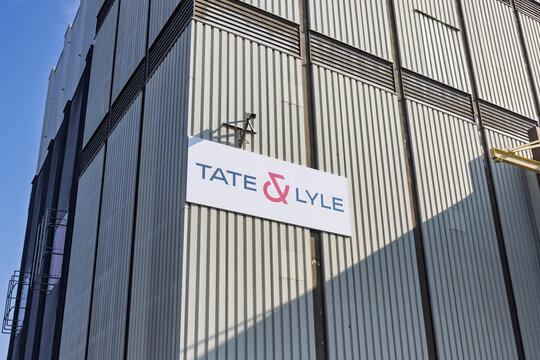 Close up of the Tate & Lyle company logo on a large industrial building facade under a clear blue sky, manufacturing facility in Zaandam, Netherlands. 18 March 2026.
