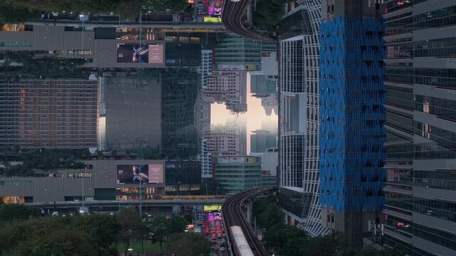 Surreal aerial mirror effect of downtown Bangkok at dusk with skyscrapers and the BTS Skytrain moving through urban landscape, captivating symmetrical cityscape