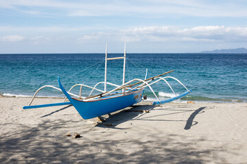 Colorful traditional banca boat by the ocean