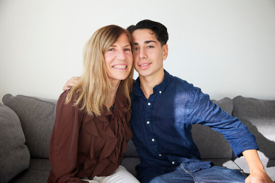 Portrait of smiling woman with her nephew at home
