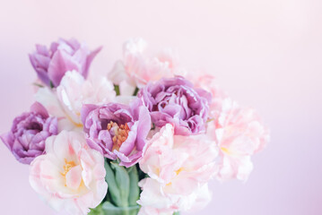 Obraz premium spring greeting background with pink and purple flowers. Romantic spring floral composition perfect for Mothers Day, greeting cards, weddings, and feminine design themes.