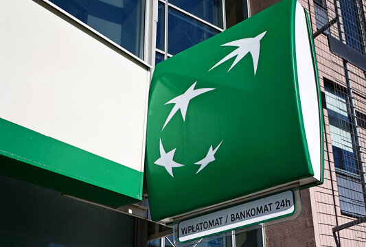 Lodz, Ł&oacute;dź, Poland, Europe - 02.2026 : BNP PARIBAS Bank logo and ATM cash and deposit machine at entrance to branch office, Piłsudskiego Avenue