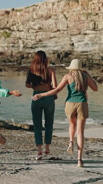 Women, friends and skip in harbor with travel on holiday, view and sunset with sightseeing trip. Happy people, group and outdoor in port town for laugh, tourism or adventure with ocean on vacation