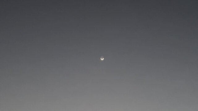 Crescent Moon in Twilight Evening Sky with Power Lines