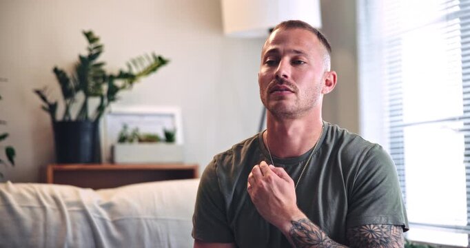 Psychology, breathe and man with eft tapping on sofa for anxiety, mental health and holistic healing. Therapy, calm and male person with spiritual energy for reiki treatment, relax or zen in home