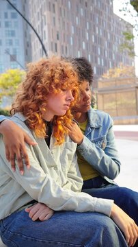 A heartfelt connection is visible as two friends share a tender moment, showcasing their emotions and support for each other during a time of vulnerability and trust, highlighting friendship and