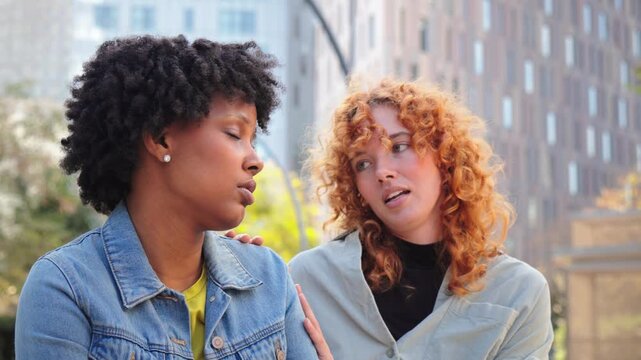 A caring friend provides emotional support to a distressed individual, showcasing compassion and understanding during a moment of vulnerability and connection between two close friends.