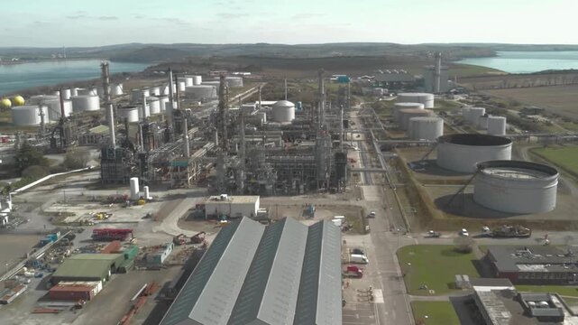 Aerial view of Petrochemical oil  Refinery and storage tanks. Massive scale of this critical energy infrastructure, featuring expansive oil storage tank farms and distillation units. 