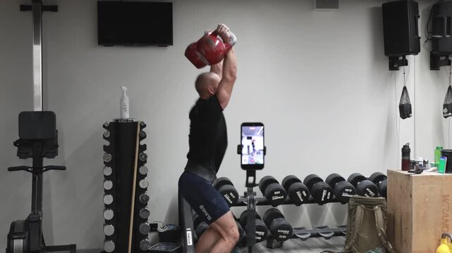 Close up of lifting kettlebells in gym, strength workout and functional training