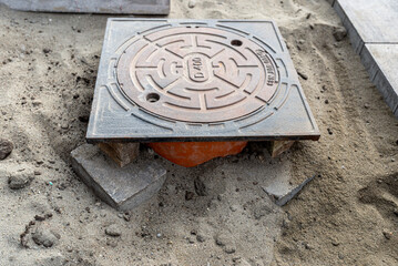 Cast iron manhole cover during sewerage construction