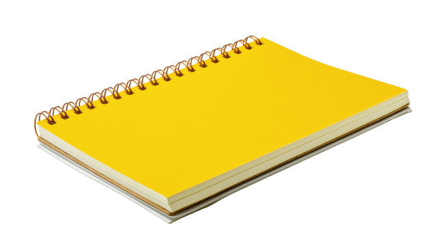 Isolated yellow spiral-bound notebook laying angled, perfect for school supplies and office work