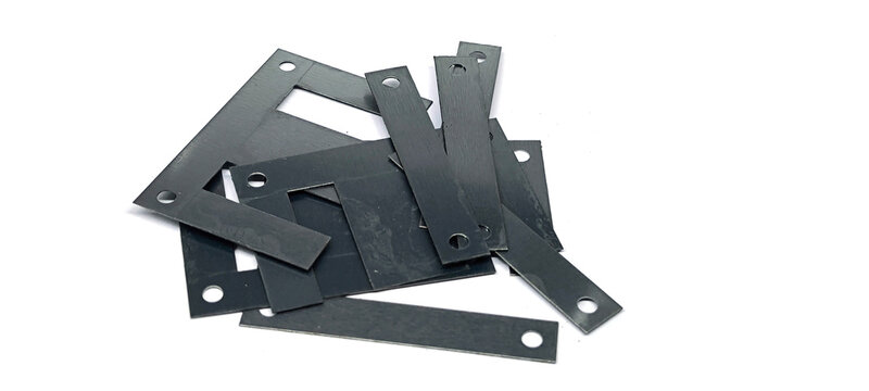 Ferrite core in a transformer on a white background.
