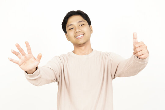Happy Young Man Showing Six Fingers Number Count