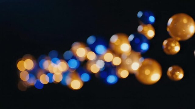 Abstract background with soft circle bokeh effects in blue and gold colors with smooth movement