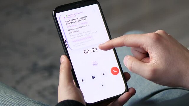 Close-up of a person confirming a product return on a smartphone. Features a 'Return Request Received' notification during a support call. Ideal for e-commerce, retail services, and modern consumer