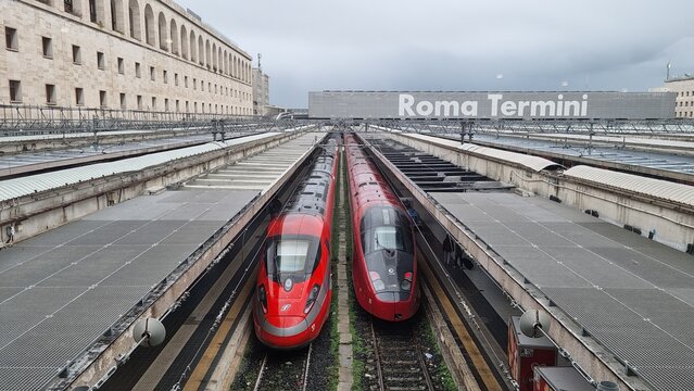 Frecciarossa Trenitalia and Italo train in Roma Termini waiting to leave. Roma Termini station railway italian. Public transport competitor on high speed trains service. 