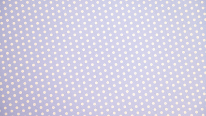 Pastel purple polka dot pattern with white dots on fabric background © Julia Jones