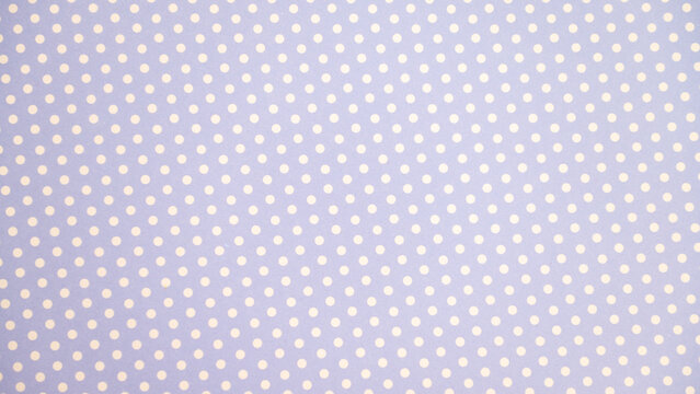 Pastel purple polka dot pattern with white dots on fabric background