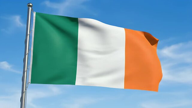 A flag with green, white, and orange vertical stripes flies against a blue sky