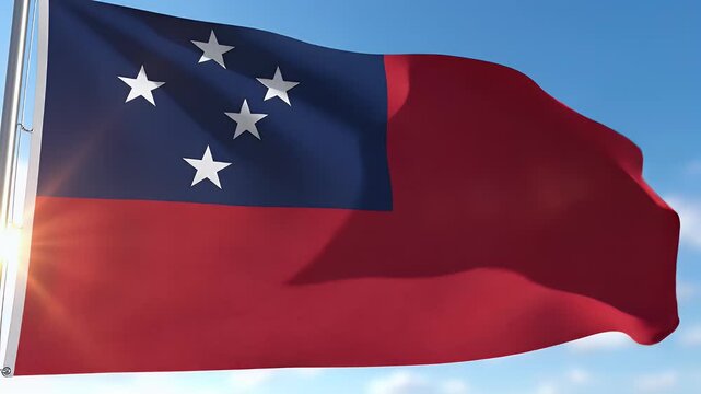 Waving flag against a bright blue sky with sun flares